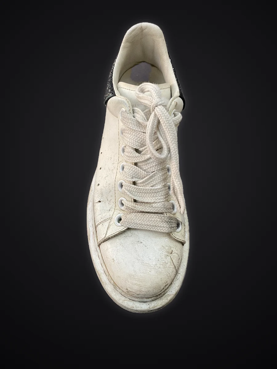 Alexander McQueen sneaker before cleaning: yellowed and stained