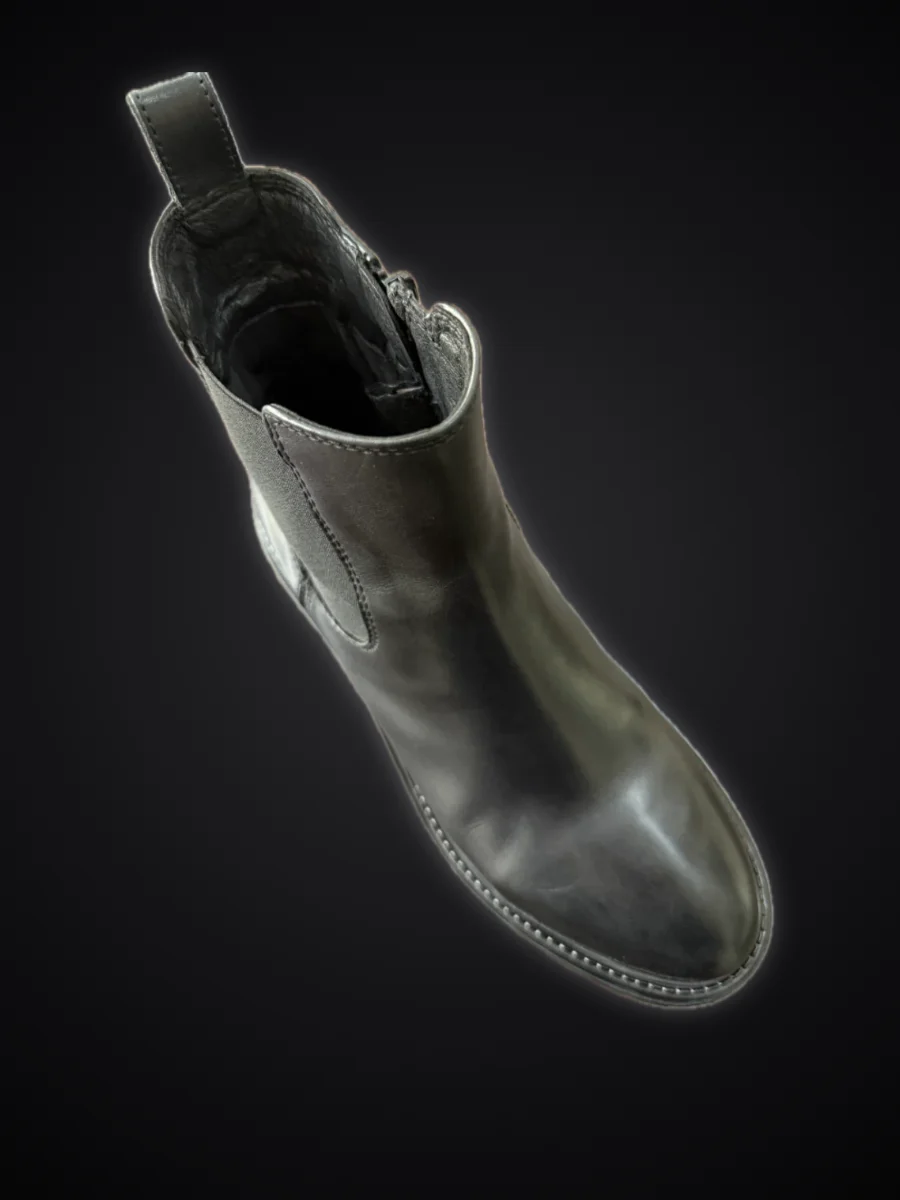 The same ankle boot after care: deep black and shiny