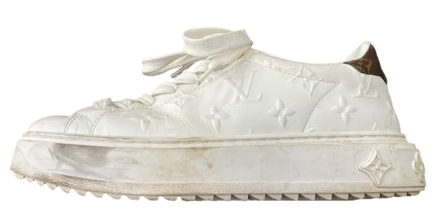 White Louis Vuitton sneaker before cleaning: greyed sole, dirt marks