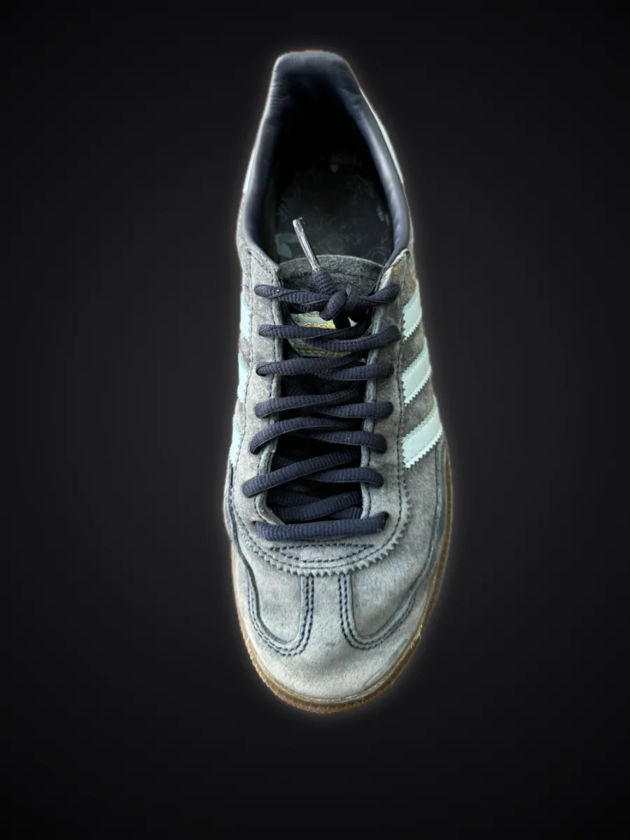 Suede sneaker before cleaning: faded and grey